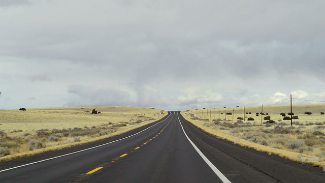 Perfectly smooth America highway across the endless desert