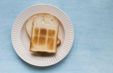White toast on blue table background