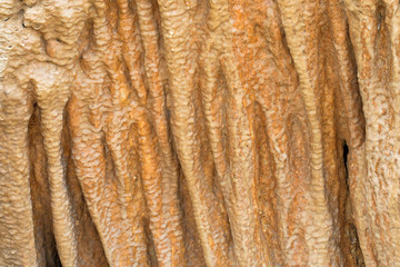 Closeup background texture cave stone curtain photo of stalactite cavern