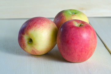 Apple isolated on wooden board background