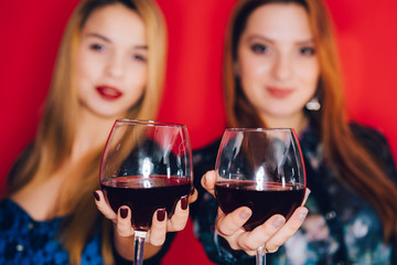 Girls and glasses of red wine