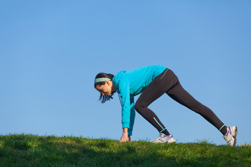 Sporty woman preparing to  run