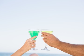 Couple sitting and drinking cocktails
