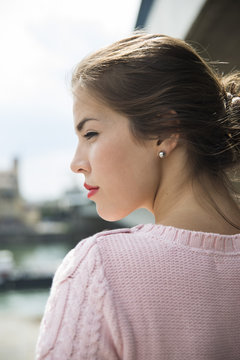 Profile of young woman with red lips