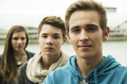 Portrait of three serious teenagers outdoors