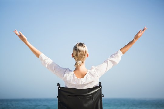 Woman in a wheelchair relaxing - Powered by Adobe