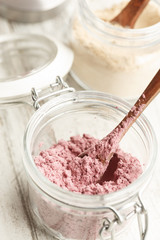 Acai and maca powder in glass jars