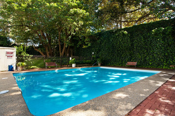 Lovely pool in the garden in the park.
