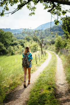 Alto Adige, teenage girl hiking on a path