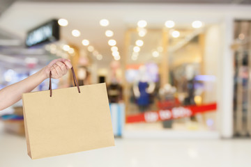 Woman with shopping bag in shopping mall