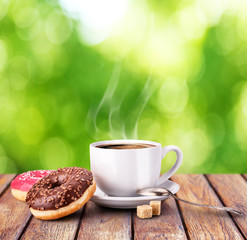 coffee mug on a wooden table nature bokeh