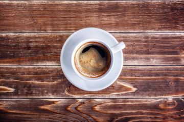 cup of coffee on the wooden table