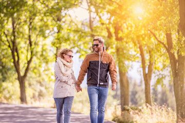 Couple in love  in autumn nature on a walk