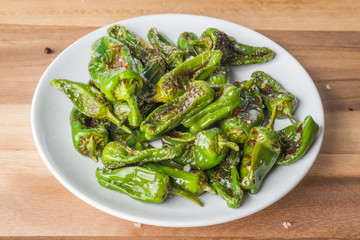 Roasted padron peppers on a plate