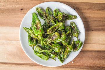 Roasted padron peppers on a plate