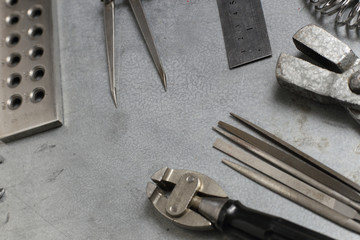 Tools set of jewellery. Jewelry workplace on metal background with copy space for text. Top view.