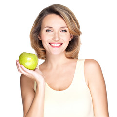 Young happy smiling woman with green apple.