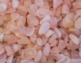a pile of rose quartz stones - obrazy, fototapety, plakaty