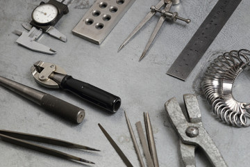 Tools set of jewellery. Jewelry workplace on metal background with copy space for text. Top view.