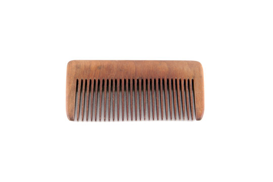 A wooden comb on a white background