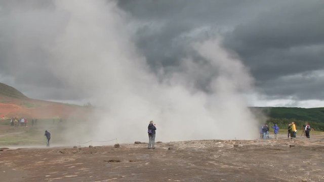 Geyser erupting at the Geysir geothermal springs in Iceland