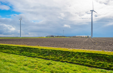 Fototapeta na wymiar Wind turbine in a field in spring