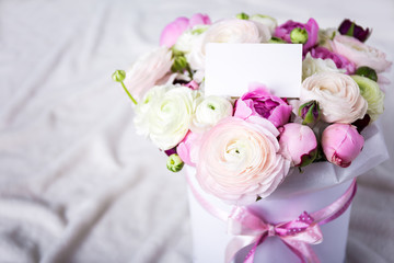 beautiful bunch of summer flowers with blank card over white