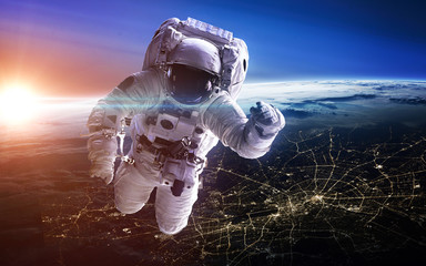 Naklejka premium Astronaut in outer space. Spacewalk. Elements of this image furnished by NASA