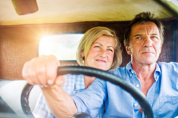 Close up of senior couple inside a pickup truck