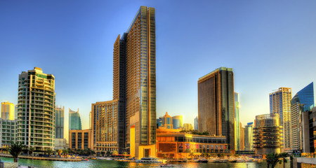 Fototapeta na wymiar Buildings at Dubai Marina Canal - UAE