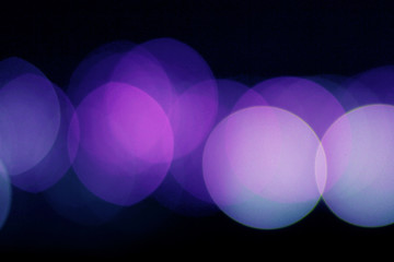 Bokeh purple lights closeup background 
