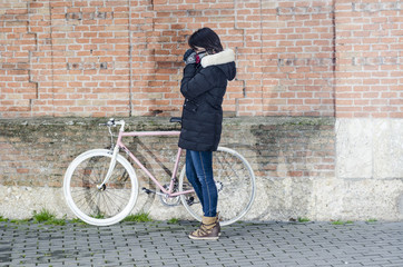 Fototapeta na wymiar Woman with pink vintage Bicycle with white wheels