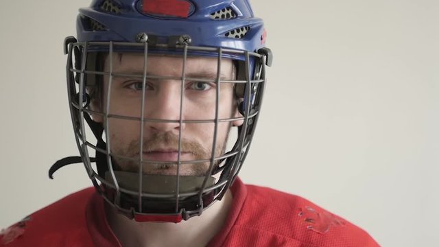 Portrait of Hockey Player Hit Helmet Slow Motion