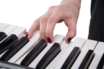 Woman playing on synthesizer 