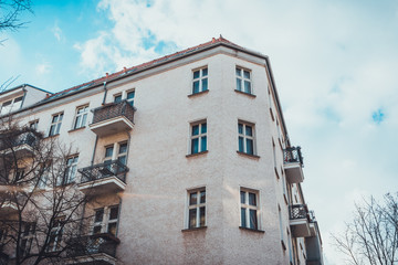 Fototapeta premium Looking Up at Corner of Apartment Building