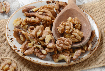 Walnuts on a wooden spoon