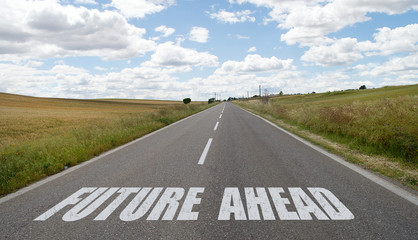 Future ahead written on the road