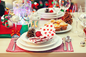 Obraz na płótnie Canvas Christmas table setting with holiday decorations