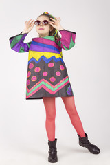 beautiful young cheerful to the girl in an original dress