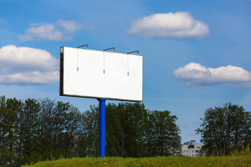 Blank billboard on blue sky background. Blank street poster. For design presentations and portfolios. Shallow depth of field. Selective focus.