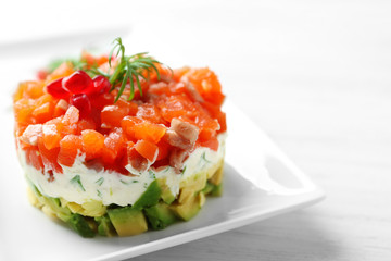 Delicious salmon tartare on white plate