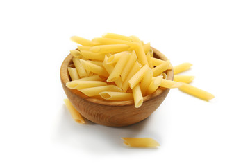 Pile of Italian dry pasta in a wooden bowl,  isolated on white