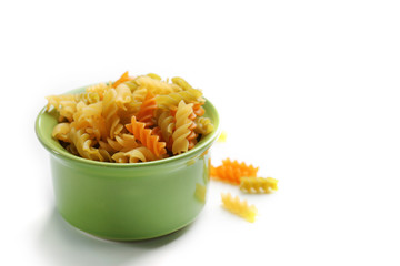 Pile of Italian dry pasta in a bowl, close up