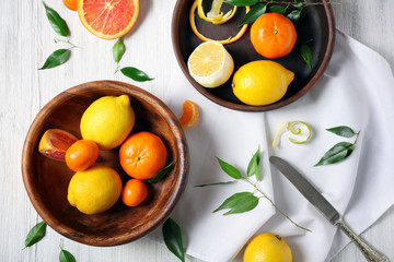 Citrus fruits in bowls, closeup