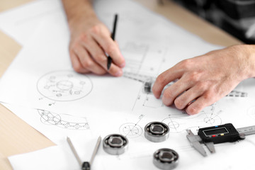 Professional engineer working with blueprints