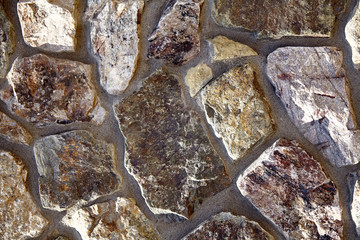 Stone Veneer granite rubble shapes and colors wall closeup