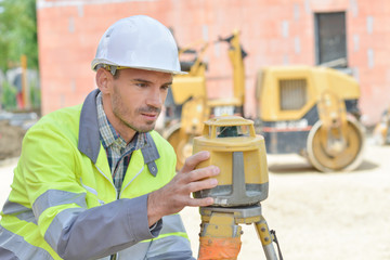 Surveyor setting up his equipment