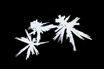 Crystals of ice on black background