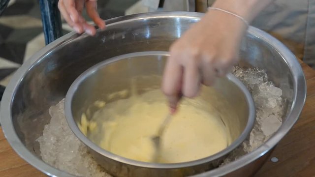 ice cream being stirred over a bain marie