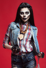 Beautiful sexy brunette model woman.Look zombie. Creative make up. Helloween concept. On red background